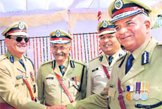 Police officers after receiving awards at Haryana Raj Bhawan in Chandigarh on Friday.
