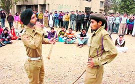 Activists of the Progressive Students Association enact a play on the Jammu University campus on Friday