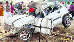 The mangled remains of the car in which the doctor was travelling