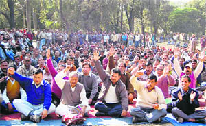 Striking ministerial employees hold a demonstration in Dehradun on Saturday. 