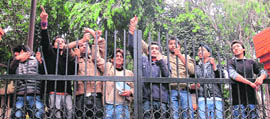 Students hold a demonstration at the main gate of Science College in Jammu