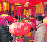 Customers shop for red lanterns to mark the Chinese Lunar New Year in Shenyang on Saturday.