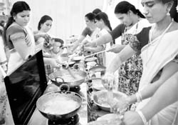 Women members of the Malayalee Samajam serve mouth-watering dishes in Mohali on Sunday.
