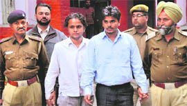 The accused in police custody at the Sector 36 police station in Chandigarh on Sunday.