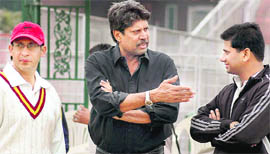 Kapil Dev in a discussion with team members.
