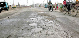 A potholed road in Sector 50 that has not been repaired for the past one year,
