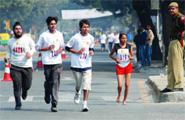People take part in Mawana Sugar Indian Open Marathon in New Delhi