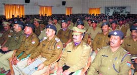 Police officials of Dehradun district attend a meeting in Dehradun on Sunday