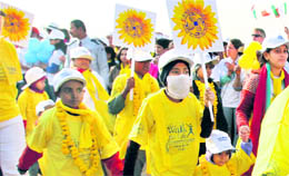 Cancer-affected children participate in a walk to create awareness about the disease in New Delhi on Sunday. 
