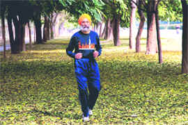 Joginder Singh Khanowal runs during his marathon in Chandigarh on Sunday.