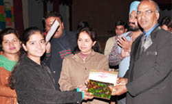 Principal of DAV College, Abohar, Dr BB Sharma, honouring meritorious students during prize distribution function