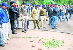 People gathered at the spot, where SPS Rathore was attacked outside the District Courts in Chandigarh on Monday.