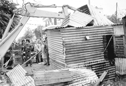 A demolition drive in progress at the Phase-XI rehri market in Mohali on Monday.