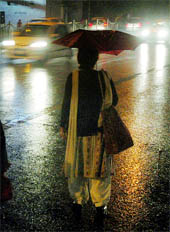 A girl takes recourse to her umbrella.