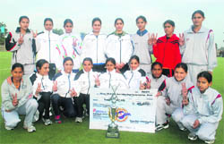 The Haryana XI eves after winning the trophy of the the sixth edition of the All-India Guru Gobind Singh Hockey Tournament in Ludhiana 