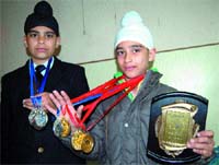 Gurkomal Singh and Ekamjot Singh show their medals.