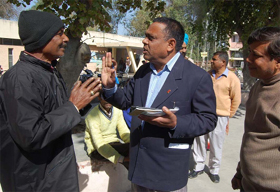 A health worker penalising a man for violating the rules that prohibited smoking at public places, at the Civil Hospital in Bathinda, on Tuesday. 