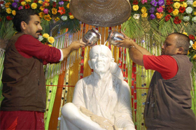 The idol of Sai Baba being offered milk on its eighth installlation day in Bathinda on Tuesday. 