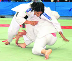 Judokas try to get the better of each other during the All-India Inter-University Judo Championship for Women at Panjab University on Tuesday.
