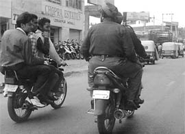 In blatant violation of traffic laws, four boys seen riding a motorcycle without helmet at Zirakpur.
