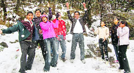 Tourists enjoying in snow, hitting each other with snowballs at Mcleodganj, near Dharamsala, on Tuesday.