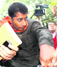Utsav Sharma, who stabbed Haryana ex-DGP SPS Rathore, being produced in a Chandigarh court on Tuesday.