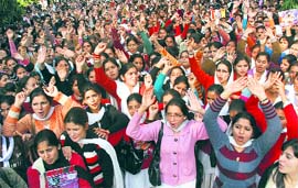 Students hold a demonstration in support of their demand for an open choice in the annual examination at Government College for Women, Gandhinagar, in Jammu on Tuesday