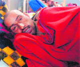Chanchal Singh, a resident of Sanasar village in Ramban district, in semi-conscious condition at Government Medical College, Jammu.