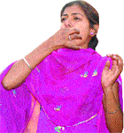 A Khalsa College girl whistles during the centenary celebrations of the college in Jalandhar.