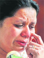 Anoma Fonseka, wife of Sarath Fonseka, breaks down as she speaks to the media in Colombo
