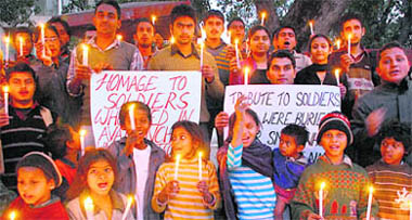 Panjab University students and others light candles to pay homage to soldiers killed in an avalanche in Jammu and Kashmir at Student Centre