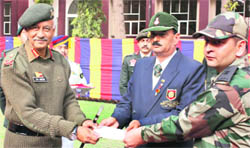 The GOC-in-C, Western Command, Lt Gen Shankar Ranjan Ghosh, felicitates a shooter in Chandigarh