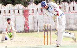   A batsman plays a shot at a match at the 58th District Cricket League on Wednesday. 