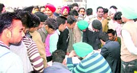 ITI students from Punjab submit their applications during the Rozgar Mela in Ludhiana on Wednesday