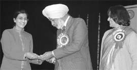 A student being honoured at the annual prize distribution function of Government Mohindra College in Patiala on Thursday.