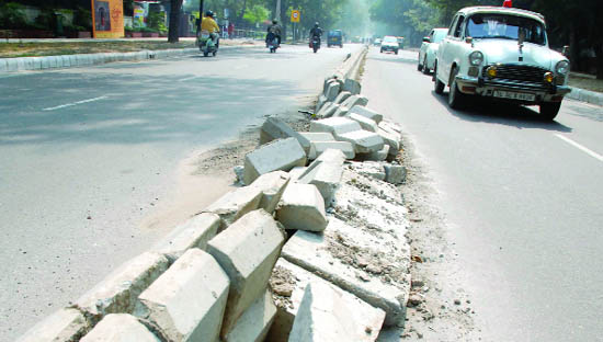 Just one spell of rain broke this newly-constructed divider near Haryana Bhawan