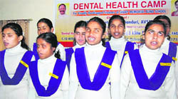 Students of Sharp Memorial School sing a welcome song at a dental health camp organised in Dehradun 