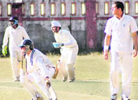 Batsmen cross over for a run during a match of the 58th District Cricket League in Dehradun