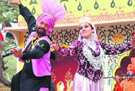 Artistes perform at a chaupal during the Surajkund crafts mela in Faridabad.