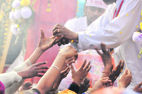 Parshad being distributed among devotees on the eve of Shivratri in Ludhiana on Thursday.