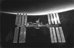 With the Earth in the background, the International Space Station is featured in this image photographed by an STS-130 crew member from aboard the Space Shuttle Endeavour in this photo released by NASA and taken February 9, 2010