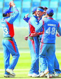   Afghanistan's Hamid Hassan (C) celebrates after taking the wicket of Timroy Allen of the U.S. during their 2010 ICC World Twenty20 qualifier in Dubai on Thursday.