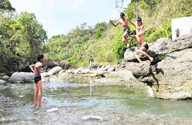 Despite severe cold,boys have a good time in the Tapkeshwar stream near Dehradun.