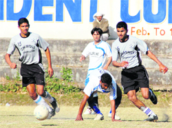Players in action at the Presidents Cup Football Tournament in Dehradun on Friday. 