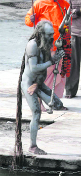 A sadhu prays on the banks of the Ganga