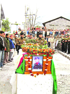 Army personnel and band giving military honours to sepoy Kalijang Dorjee at the Bhootnath cremation grounds in Kullu on Friday. 