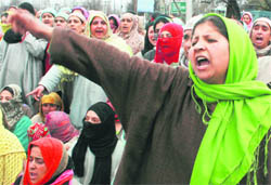 Residents of Nishat and relatives of 16-year-old Zahid Farooq, who was allegedly killed by security forces last week, protest against his death, demanding punishment for the killers