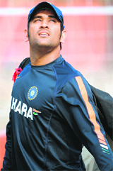 MS Dhoni looks on as he heads for a practice session ahead of the second Test between India and South Africa at the Eden Gardens in Kolkata on Friday.
