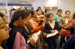 Students of Dayanand Ayurvedic College, Jalandhar ,taking notes at a stall of Herbal medicines during their visit to Arogya Mela at Government Rajindra College in Bathinda on Saturday.