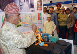 Magician Ved Parkash spreading a message against AIDS and other diseases at Arogya Mela in Bathinda on Saturday. 